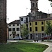 Via Vigo di Torre, qui un tempo correva il fossato con le acque derivate dal Sirone. Si vede il campanile della non più esistente chiesa di San Girolamo.