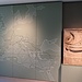 Un pannello raffigurante le vie di comunicazioni romane con un altorilievo raffigurante una nave.