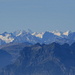 Zoom in to the VS/BE Alps. According to [http://www.gipfelderschweiz.ch/panorama/744885232645_pano.html], one can see Wetterhorn, Eiger, Mönch, Jungfrau, Finsteraahorn and alike. The prominent peaks in the foreground are Rautispitz and Wiggis