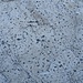 <b>Apliti di Capo Bianco.<br />Sono rocce Porfiriche Leucocrate aventi una composizione Granitica a feldspati alcalini (Quarzo, Muscovite, K-feldspato, Oligoclasio).<br />Queste Apliti sono caratterizzate dalla presenza di orbicole e grumi tondeggianti di Tormalina blu (Eurite).</b>