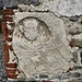 Nella parete meridionale è stata inserita una lapide di origine romana.