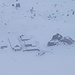 Die Alphütten von Mädems Hintersäss verschwimmen im Nebel