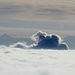 Die Dampfwolke eines AKW's (wohl Gösgen?) vor den Schweizer Hochalpen