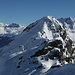 Piz Lunghin - view from Piz dal Sasc. Two skiers are at the summit. It seems that currently you need to walk on foot for quite some distance to reach the summit.