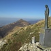La madonnina sulla cima del Monte Rai che domina la pianura; in centro foto il Cornizzolo e il Rifugio Marisa Consiglieri.