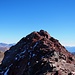 Blick vom provisorischem Gipfel zum höchsten Punkt des Piz Lischana, der aufgrund von Felssturzgefahr nicht betreten werden sollte.