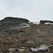 Further up, shortly before the summit comes a short but steep area with big rocks and boulders. They are mostly stable though. I entered that area just below the snowfield in the center of this picture. Difficulty: T4.