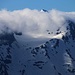 Torrone di Garzora (3017,0m).<br /><br />Im Zoom, den Wolkenfetzen und mit dem Schnee sah der Berg viel höher aus als er in Tatsache ist. Immerhin ist's ein knapper Dreitausender.