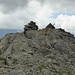 The summit of Piz Forun from the north. There are two cairns, and the summit book is in the northern cairn.