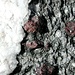 <b>Granati</b>, varietà <b>Almandino</b>.<br />Sono minerali appartenenti al gruppo dei silicati. Essendo molto diffusi, i granati vengono usati come materiale abrasivo nel taglio e lucidatura delle rocce e come <b>gemme</b>.<br />Il rosso rubino spicca soprattutto in prossimità delle bianche vene quarzifere.