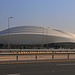 Tag 2 (25.12.): استاد الجنوب - ’Istād al Janūb.<br /><br />Das Janoubstadion bei الوكرة‎ (Al Wakrah) wurde im Mai 2019 eröffnet und wird einer von acht Austragungsorten für die Fussball-Weltmeisterschaft 2022 sein. Es steht südlich der Hauptstadt und hat eine Kapazität von 40000 Plätzen.