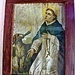 San Domenico, Santo Domingo<br />"In der katholischen Kirche gilt der hl. Dominikus als Schutzpatron der Astronomen, der Wissenschaftler, der fälschlich Angeklagten, der Dominikanischen Republik und der Städte Bologna, Madrid und Córdoba. Er wird meist mit den Attributen Kreuz, Rosenkranz, Buch und Weltkugel, Lilien, einem Stern über der Stirn und einem Hund mit brennender Fackel dargestellt."