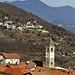 Il campanile di San Michele spunta dai tetti di Massino Visconti.