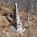 Just above Troggiano, at this Cross, you have the option of  two routes to reach the alpine farm at approximately 1.140m elevation. The most direct one (also indicated by a panel) runs right behind the Cross.
