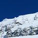 La cima di Gana Rossa, in un momento di sole e cielo azzurro. 
Si vedono l'ometto e la croce