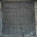 Bronzetafel. Das Original war aus Stein und befindet sich wohl immer noch in einem Hausgang in Bennwil.<br />Ano 1718 ist dieser mit zwey <br />Röhren laufende neue Bron-<br />nen under Hr. Joh. Jacob<br />Thurneysen der Zeit Ober-<br />vogt auf Waldenburg durch<br />Mr. Heinrich Bauman Zimer-<br />man von Waldenburg in das<br />Schloss gerichtet worden.