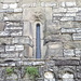 <b>Mendrisio - Chiesa di San Martino e San Rocco (XII - XIII sec.).<br />Arcatelle cieche in tufo e monofora decorata da un bassorilievo con un'aquila in volo.</b>