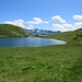 Il Lago Tom, dalla cascina si diparte il sentiero per la Bocchetta di Camoghè.