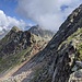 Il colle del Forno (che non raggiungeremo). Punta del Cortese al centro, in parte nascosta dalla nuvole.