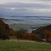 Aussicht von der Grenze Tannenwald oberhalb Flüh ins Birsigtal in Richtung Basel mit der Sankt Chrischona (522m) am Horizont.