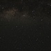 Eine Minute lang berlichtetes Foto von den Horombo Huts (3715m) aus zum südlichen Sternhimmel. <br /><br />Die leuchtende Wolken in das Zentrum unserer Galaxie im Sternbild Sagittarius (Schütze). Deutlich zu sehen sind auch die Dunkelwolken vor der leuchtenden Milchstrasse. <br /><br />Rechts oben ist das Sternbild Scorpius (Skorpion), links und links oben der Sagittarius, in der Mitte unten die Corona Australis (Südliche Krone) und rechts unten die Ara (Altar). Norden ist links Oben, Süden rechts Unten.