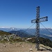 Gipfelkreuz Stein am Mandl, im Hintergrund Dachstein, Grimming und Totes Gebirge