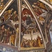 L'interno della Chiesa di San Vigilio a Pinzolo. Abside con cupola divisa in sei vele. Al centro il grande affresco della crocefissione. Nelle vele centrali la raffigurazione di Dio Padre.