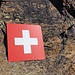 Das weithin sichtbare Schweizerkreuz markiert den Einstieg zum Klettersteig