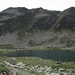 il lago Grande e sullo sfondo il ben visibile sentiero che sale al passo Portun,dal quale si vede il lago di Poschiavo (CH)