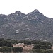 Il Monte Acuto (a destra) come appare dalla SS 597 (Sassari-Olbia) nei pressi dello svincolo di Berchidda.