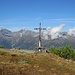 Ich komme an einem Kreuz vorbei.
