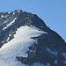 Drei Bergsteiger steigen von der Senggchuppa ab.