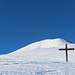 Das Kreuz bei der Alp Obersäss mit Blick zum Fadeuer.