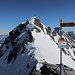 Piizolsattel mit Warnschild vor dem Felssturz