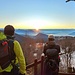 Tra le baite sopra l’Alpe Ompio, sosta per ammirare il sole che sta spuntando dallo strato di nubi che stagna sulla Pianura Padana oltre il Lago Maggiore. (foto Marco)