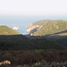 Vista verso il mare dove spiccano il Pan di Zucchero e le scogliere di Porto Flavia.