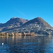 Der Monte Brè, der zweite Hausberg von Lugano. Hier reicht die Agglomeration Lugano fast bis zur Gipfelkuppe hinauf. Links sind noch die Denti della Vecchia sichtbar.
