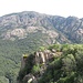 Sul lato opposto della valle, dove scorre il Rio Leni, le granitiche cime del Massiccio del Monte Linas.