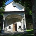 A circa 1/3 della mulattiera ecco comparire nel bosco contraddistinto da numerosi castagni secolari, la bella chiesa della Madonna di Livo.