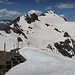 Beginn der Skipiste auf dem Pic Blanc - einige verrückte Biker fahren die mit Schnee ab!