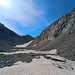 Dalla piana a q.2300mt della Val Muretto, il Passo del Muretto a sinistra, con terra rossastra