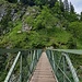 Diese eiserne Brücke über die Klamm wurde 1888 errichtet, von der Sektion München des deutschen und österreichischen Alpenvereins. Den Entwurf lieferte der königliche Brückeningenieur Ebert, ausgeführt wurde die Konstruktion von der Maschinenbau-Actien-Gesellschaft Nürnberg, Filiale Gustavsburg.