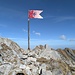 der Schofberg Vorgipfel mit wegweisendem Schweizerkreuz