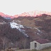 La stradina sale con buona pendenza e ben presto i panorami si allargano; qui vediamo il sole che sta illuminando il gruppo delle Grigne.