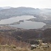 L’inconfondibile sagoma del Lago di Annone; in basso a destra la chiesa romanica di San Pietro al Monte.