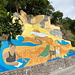 Unweit von Well's Bay - Kunst am Straßenrand, u. a. mit häufig auf der Insel anzutreffenden Tieren: Leguane, Ziegen und Geckos. Eigentlich hätten noch Hühner dazugehört ;-). 