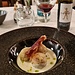 <b>La cena comincia con un piatto di canederli di pane e speck gratinati al forno con fonduta al formaggio taleggio.</b>
