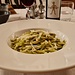 <b>La cena comincia con un piatto di trofie al pesto di basilico, pinoli e scaglie di pecorino.</b>