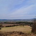 Eine Schneise Richtung Nordwesten erlaubt einen Blick hinüber zur Rhön, die mit Platzer Kuppe, Totnansberg, Schwarzenberg, Kreuzberg, Hoher Hölle und Heidelstein aufwarten kann.