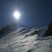 Die Sonne direkt über dem Piz Malmurainza. Nur noch wenige Meter bis zum Gipfelgrat.
